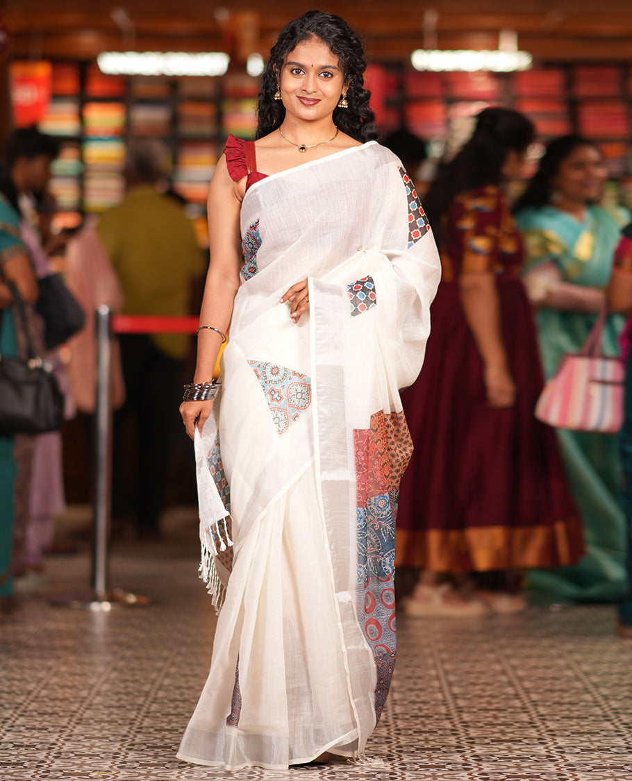 Cream Linen Cotton Saree, Gleamed Up with Triangle Motifs Print, a Zari Border, Printed Pallu, and a Contrast Blouse