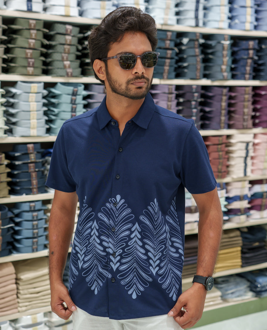 Navy Blue Cotton-Blended Casual Shirt Comes with Tropical Floral Print, Spread Collar, Half Sleeves, Regular Fit, and Regular Length