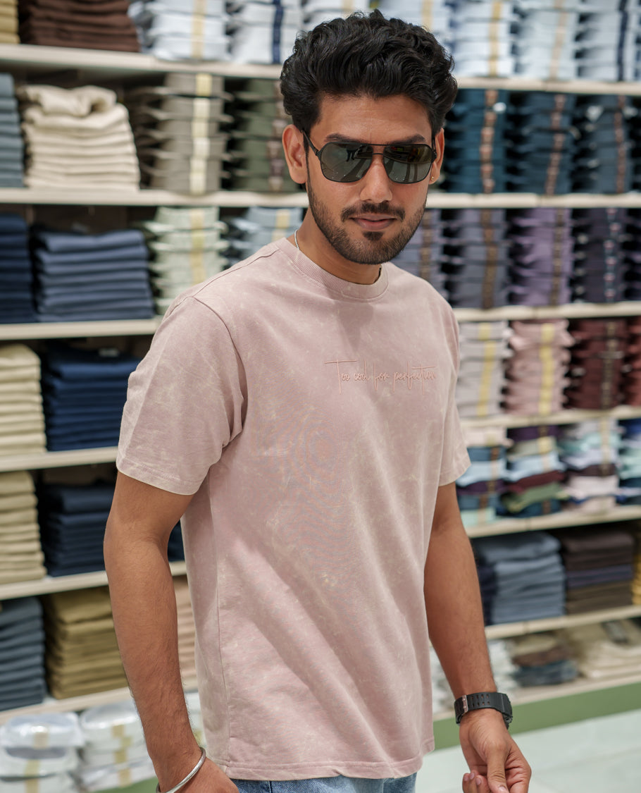 Pink Cotton-Blended Lava-Wash T-Shirt Comes with a Typographic Print, Crew Neck, Half Sleeves, Oversized Fit, and Regular Length