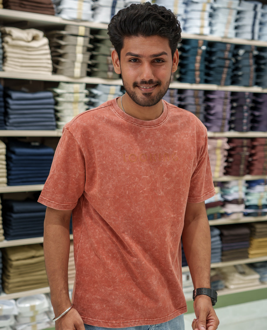 Orange Cotton-Blended Lava-Wash T-Shirt Comes with a Typographic Print, Crew Neck, Half Sleeves, Oversized Fit, and Regular Length