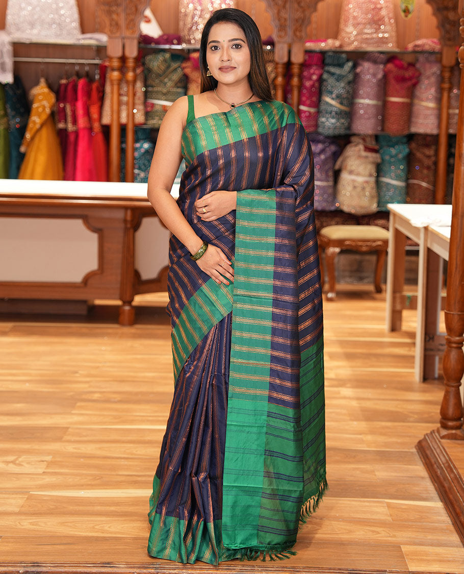 Navy Blue Semi-Soft Silk Saree, Elevated with Chevron Stripes, Complemented by a Contrast Zari Striped Border, and a Contrast Blouse
