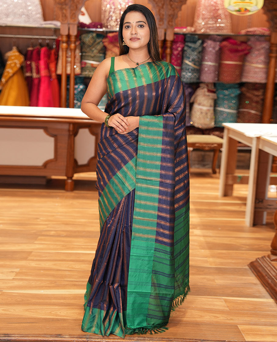 Navy Blue Semi-Soft Silk Saree, Elevated with Chevron Stripes, Complemented by a Contrast Zari Striped Border, and a Contrast Blouse