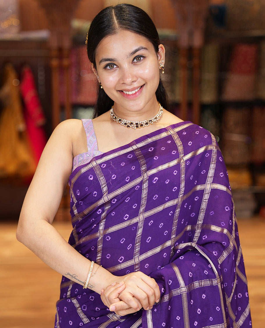 Borderless Purple Assam Silk Saree, Richly Detailed with Bandhani-Dotted Ghar Chola Design on Its Body, Gleaming Zari Pallu, and Paired with a Matching Blouse