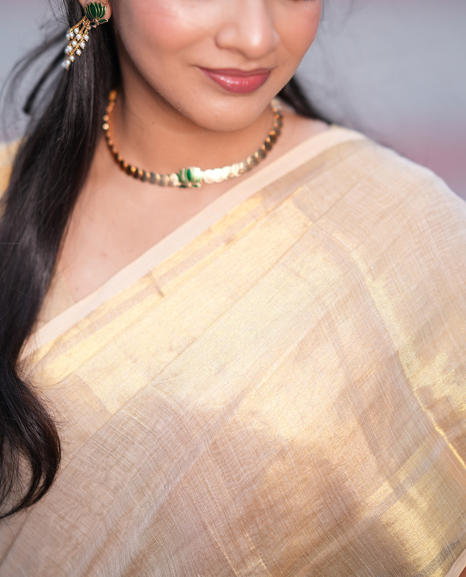 Gold Plain Tissue Mul Cotton Saree, Subtly Sparkled with Zari Border, Gleaming Zari Woven Pallu, and Paired with a Matching Blouse