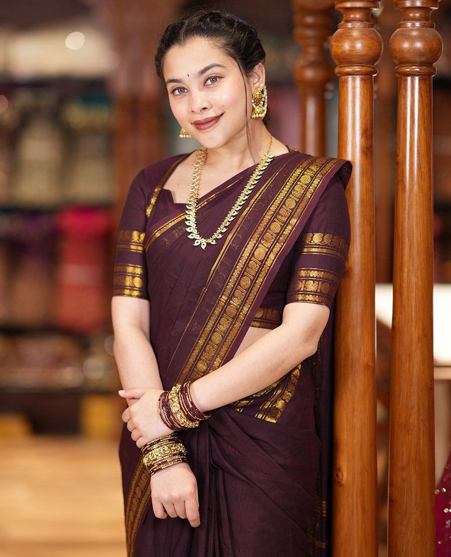 Coffee Brown Plain Chettinad Cotton Saree Graced with a Gleaming Zari Rettai Pettu Border Featuring Peacock, Rudraksham, and Neli Designs, Subtly Striped Pallu, and Paired with a Matching Blouse