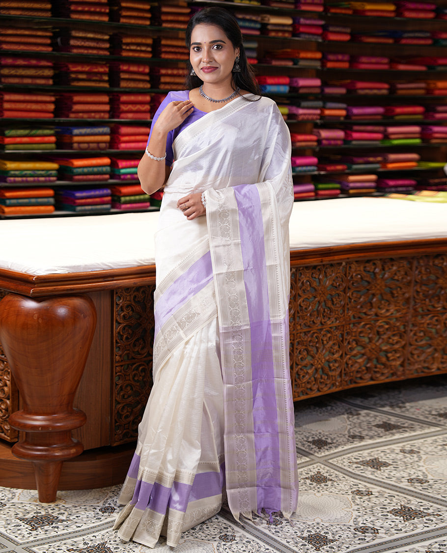 Off-White and Lavender Mangalagiri Silk Saree, Sparsely Woven Stripes on Its Body, Complemented by Contrast Border of Temple and Peacock Designs, Striped Pallu, and Paired with a Contrast Blouse