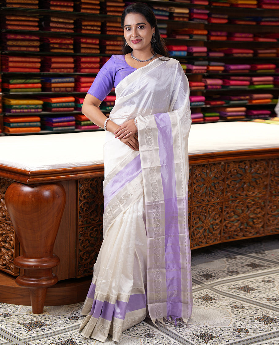 Off-White and Lavender Mangalagiri Silk Saree, Sparsely Woven Stripes on Its Body, Complemented by Contrast Border of Temple and Peacock Designs, Striped Pallu, and Paired with a Contrast Blouse