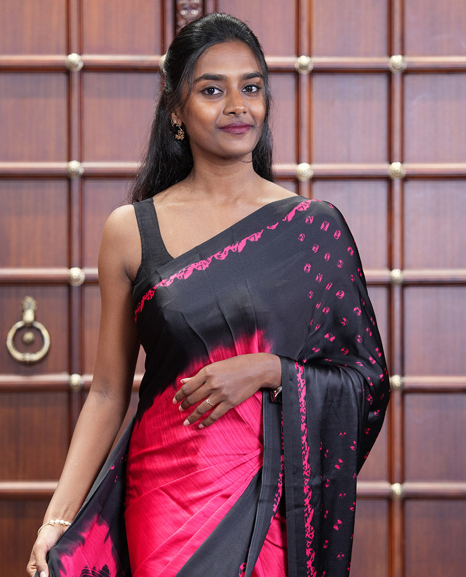 Black and Red Satin Crepe Saree Elevated with Shibori Prints, Complemented by Contrast Shibori Printed Border, Pallu Decked Up with Shibori Prints, and Paired with a Plain Blouse