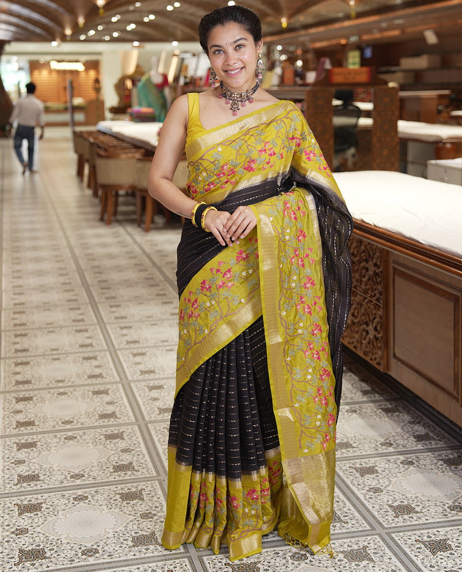 Black Assam Silk Saree Featuring Horizontal Zari Stripes, Contrast Floral Embroidered Border, Zari Striped Pallu, and a Contrast Blouse