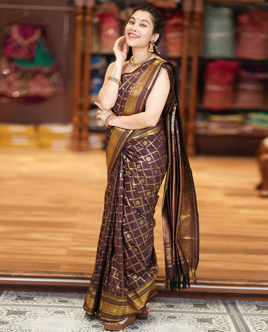 Coffee Brown Kanchipuram Budget Silk Saree Adorned with Peacock and Chakram Enclosed Checks, Highlighted with Varisai Pettu Border of Peacock Designs, Grandly Embellished Zari Pallu of Geometric Designs, and Paired with a Matching Blouse