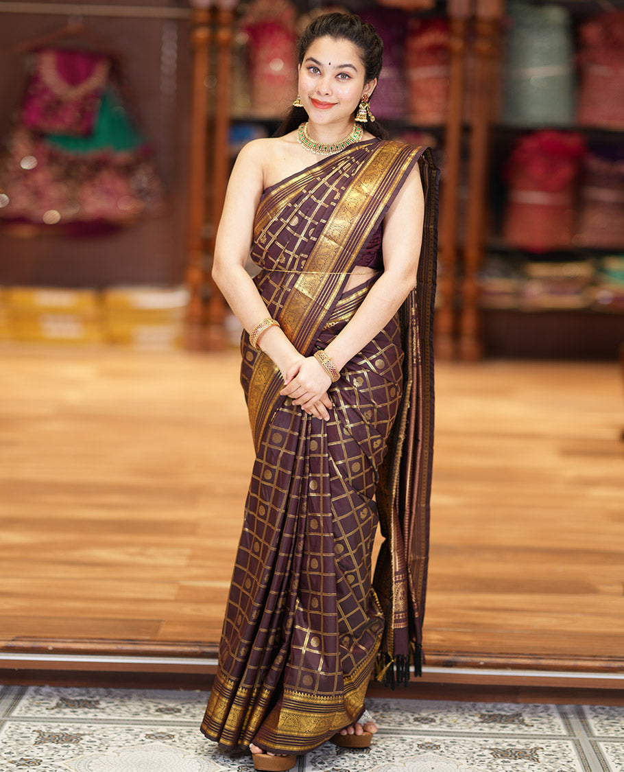 Coffee Brown Kanchipuram Budget Silk Saree Adorned with Peacock and Chakram Enclosed Checks, Highlighted with Varisai Pettu Border of Peacock Designs, Grandly Embellished Zari Pallu of Geometric Designs, and Paired with a Matching Blouse