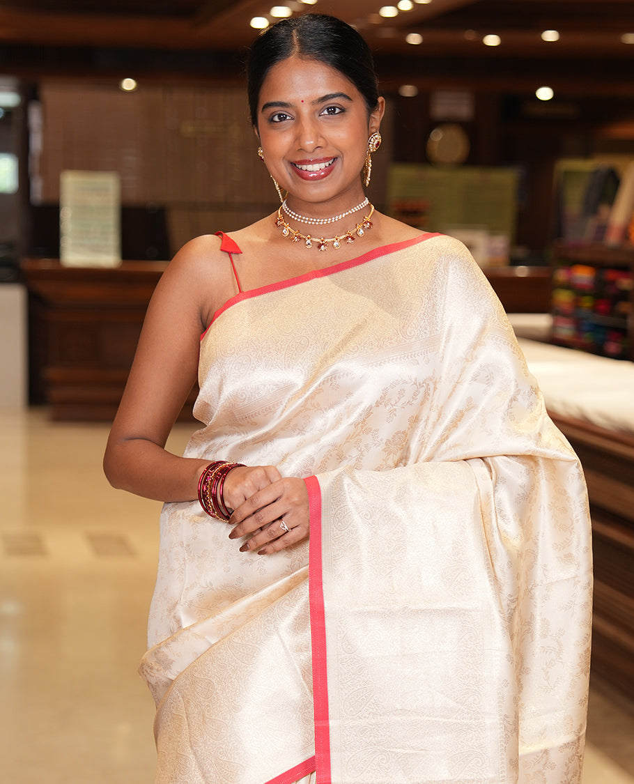 Off-White-Red Semi-Silk Saree, Adorned with Floral Jacquard Design, a Zari Paisley Border, and a Contrast Blouse