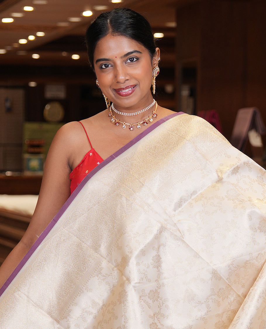 Off-White-Purple Semi-Silk Saree, Adorned with Floral Jacquard Design, a Zari Paisley Border, and a Contrast Blouse