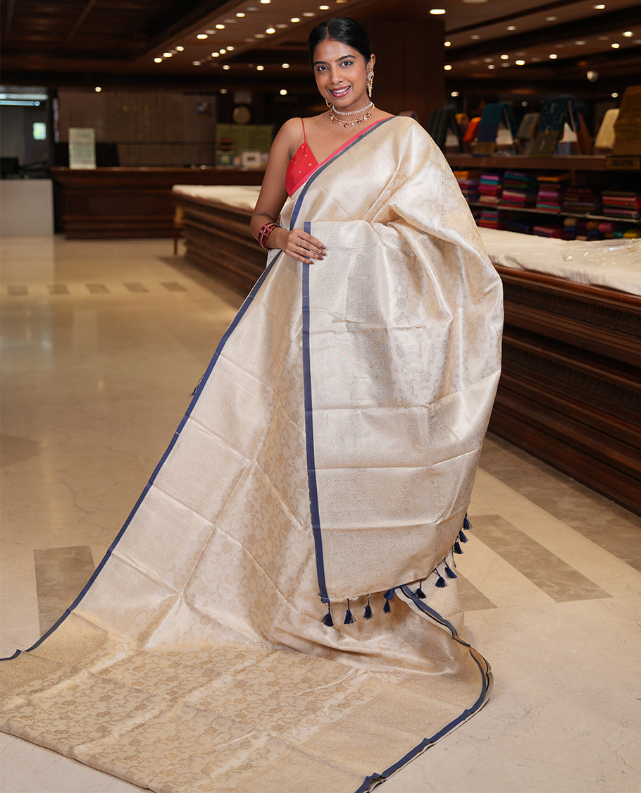 Off-White-Navy Semi-Silk Saree, Adorned with Floral Jacquard Design, a Zari Paisley Border, and a Contrast Blouse