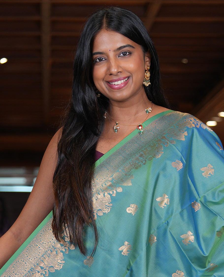 Peacock Blue Soft Silk Saree, Ornamented with Horse-Peacock Buttas, a Zari Border, Jaal Pallu, and a Matching Blouse