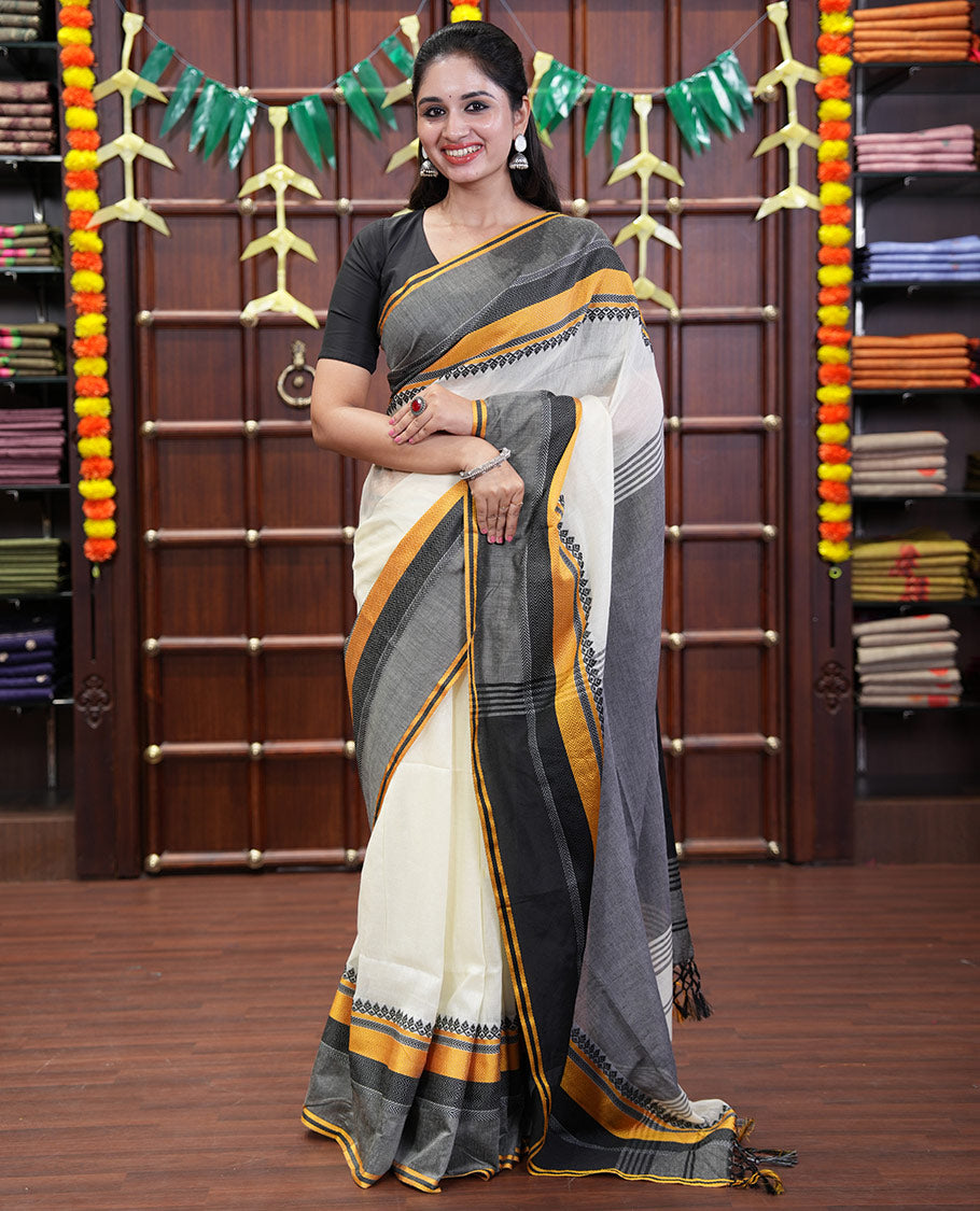 Cream-Black Plain Khadi Mul Cotton Saree, Complemented by a Contrast Thread-Woven Border of Geometric Patterns, Contrast Plain Pallu, and Paired with a Matching Blouse