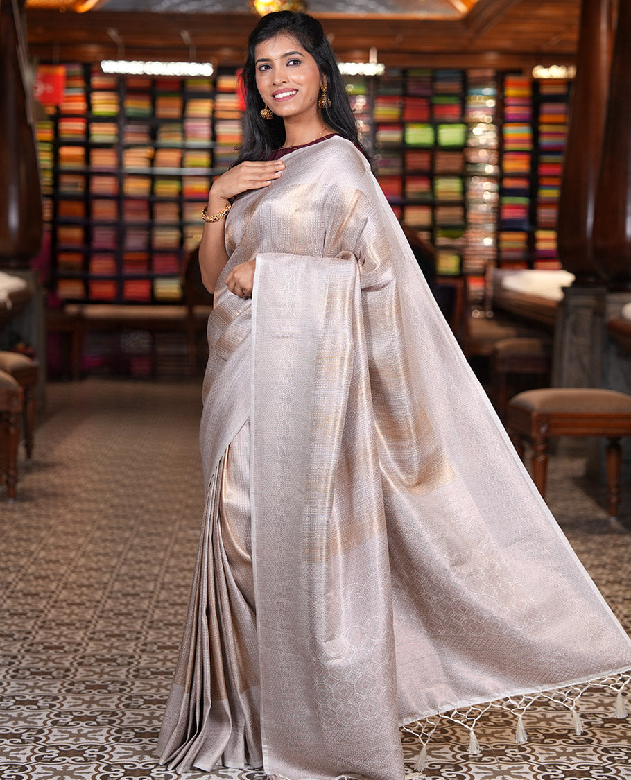 Cream Elite Soft Silk Saree, Gleamed up with Jacquard Design, Highlighted by Traditional Zari Border, Grand Pallu and a Matching Blouse