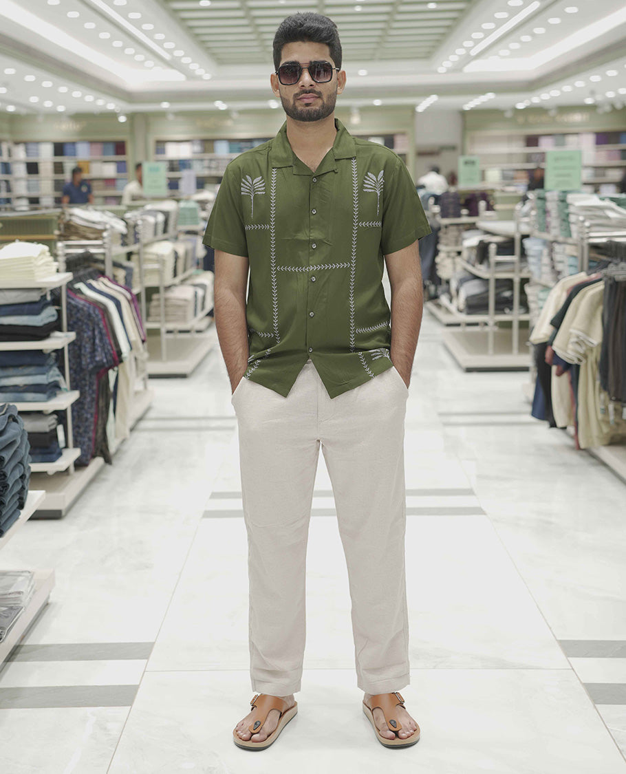 Dark Green Cotton-Blended Casual Shirt, Subtle Sparkled with Contemporary Prints, Comes with a Cuban Collar, Half-Sleeves, Regular Fit, and Regular Length