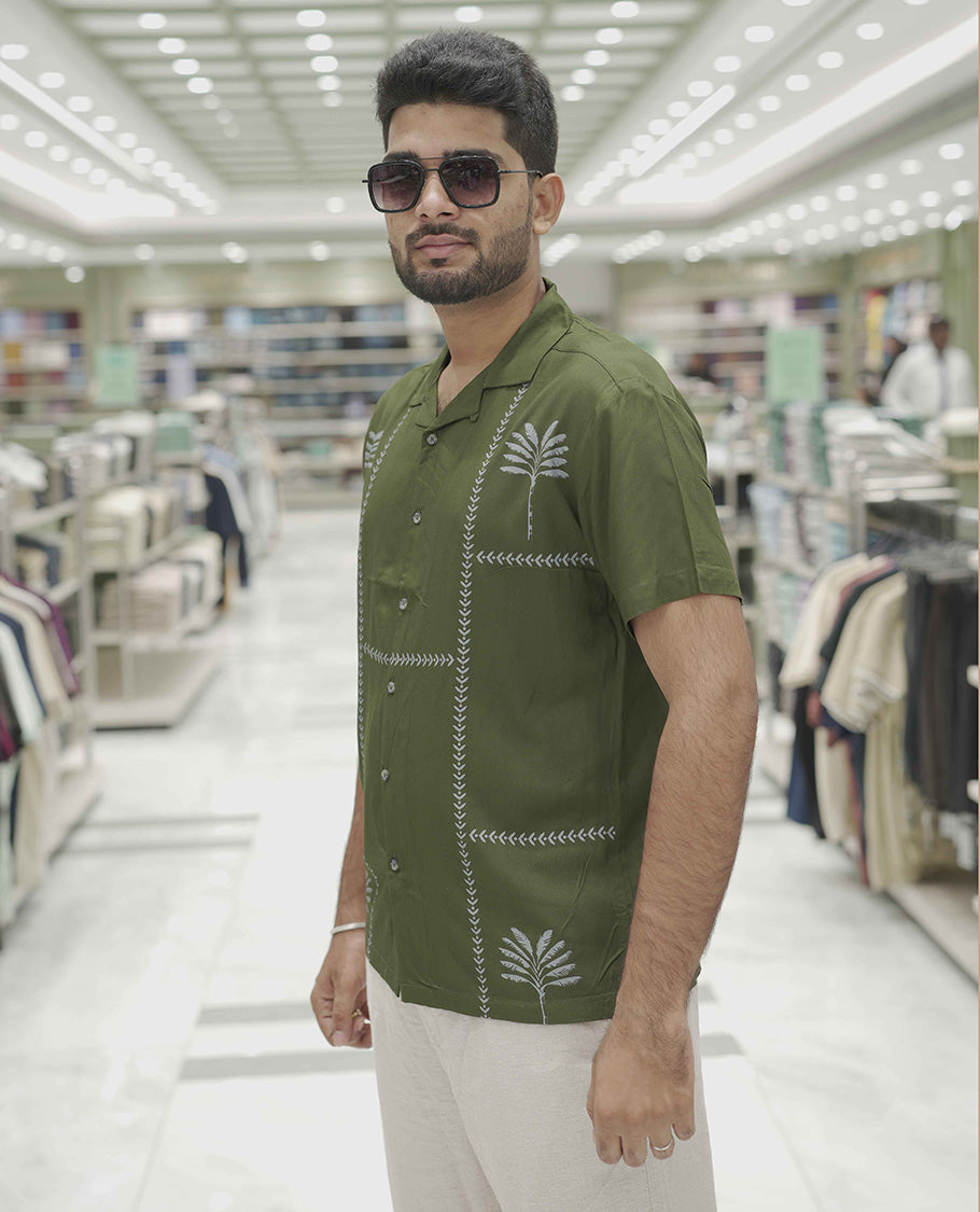 Dark Green Cotton-Blended Casual Shirt, Subtle Sparkled with Contemporary Prints, Comes with a Cuban Collar, Half-Sleeves, Regular Fit, and Regular Length
