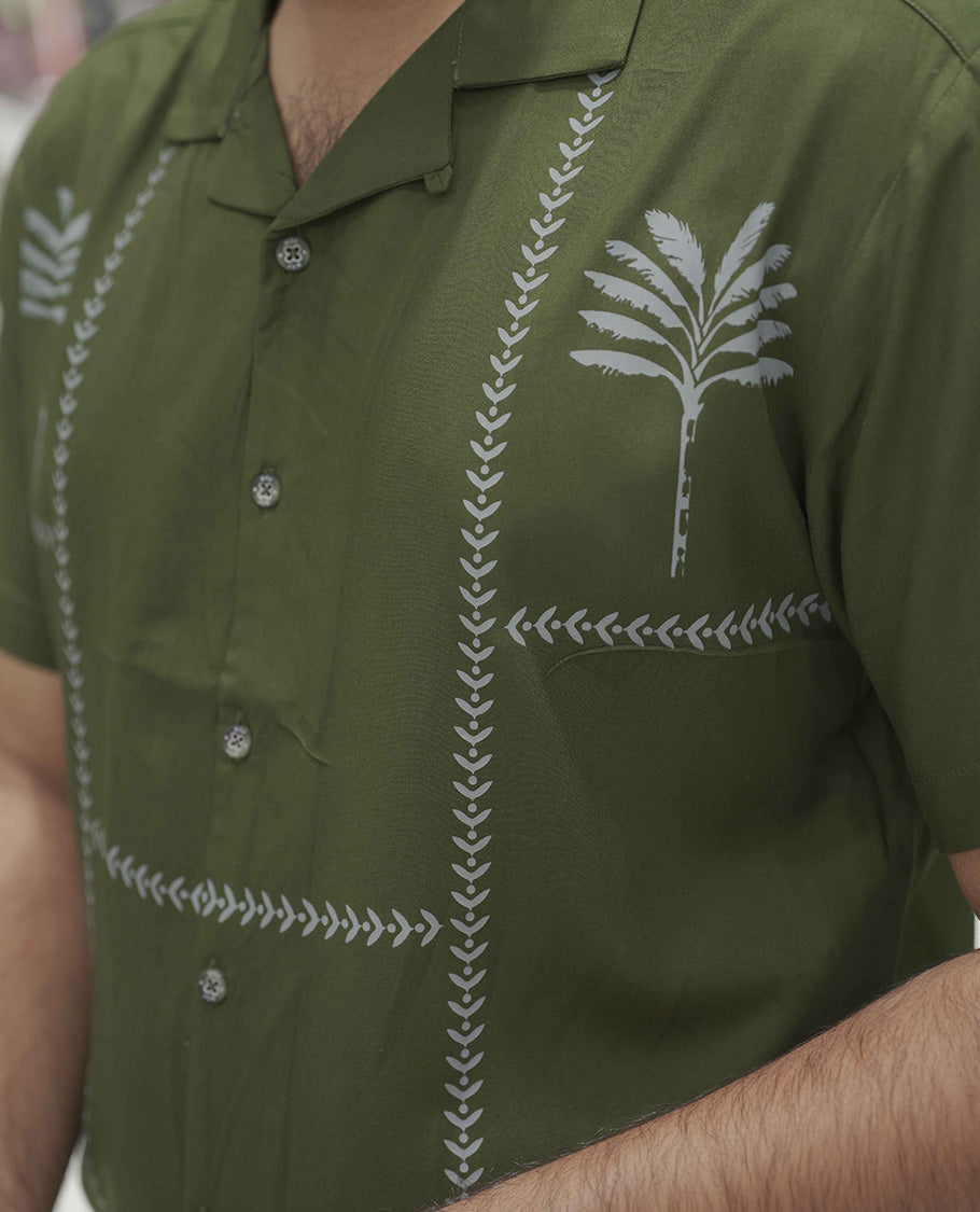Dark Green Cotton-Blended Casual Shirt, Subtle Sparkled with Contemporary Prints, Comes with a Cuban Collar, Half-Sleeves, Regular Fit, and Regular Length
