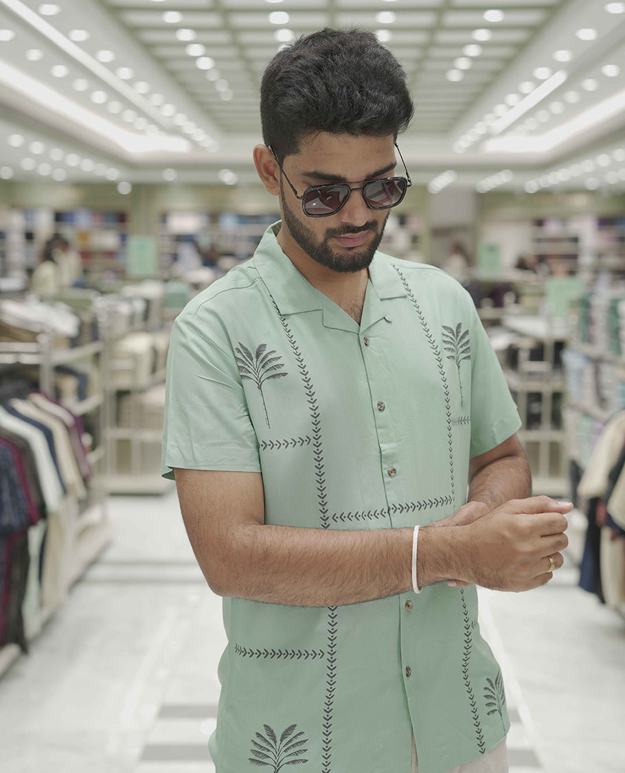 Teal Cotton-Blended Casual Shirt, Subtle Sparkled with Contemporary Prints, Comes with a Cuban Collar, Half-Sleeves, Regular Fit, and Regular Length