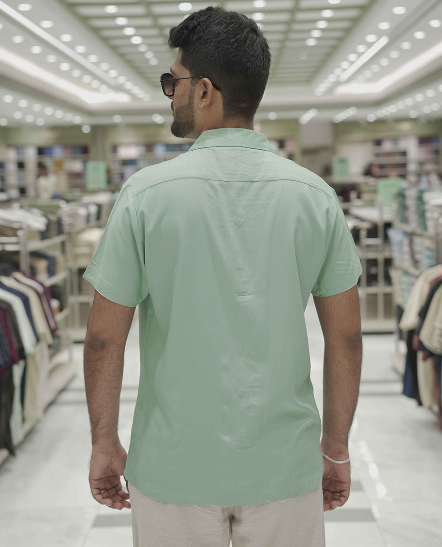Teal Cotton-Blended Casual Shirt, Subtle Sparkled with Contemporary Prints, Comes with a Cuban Collar, Half-Sleeves, Regular Fit, and Regular Length