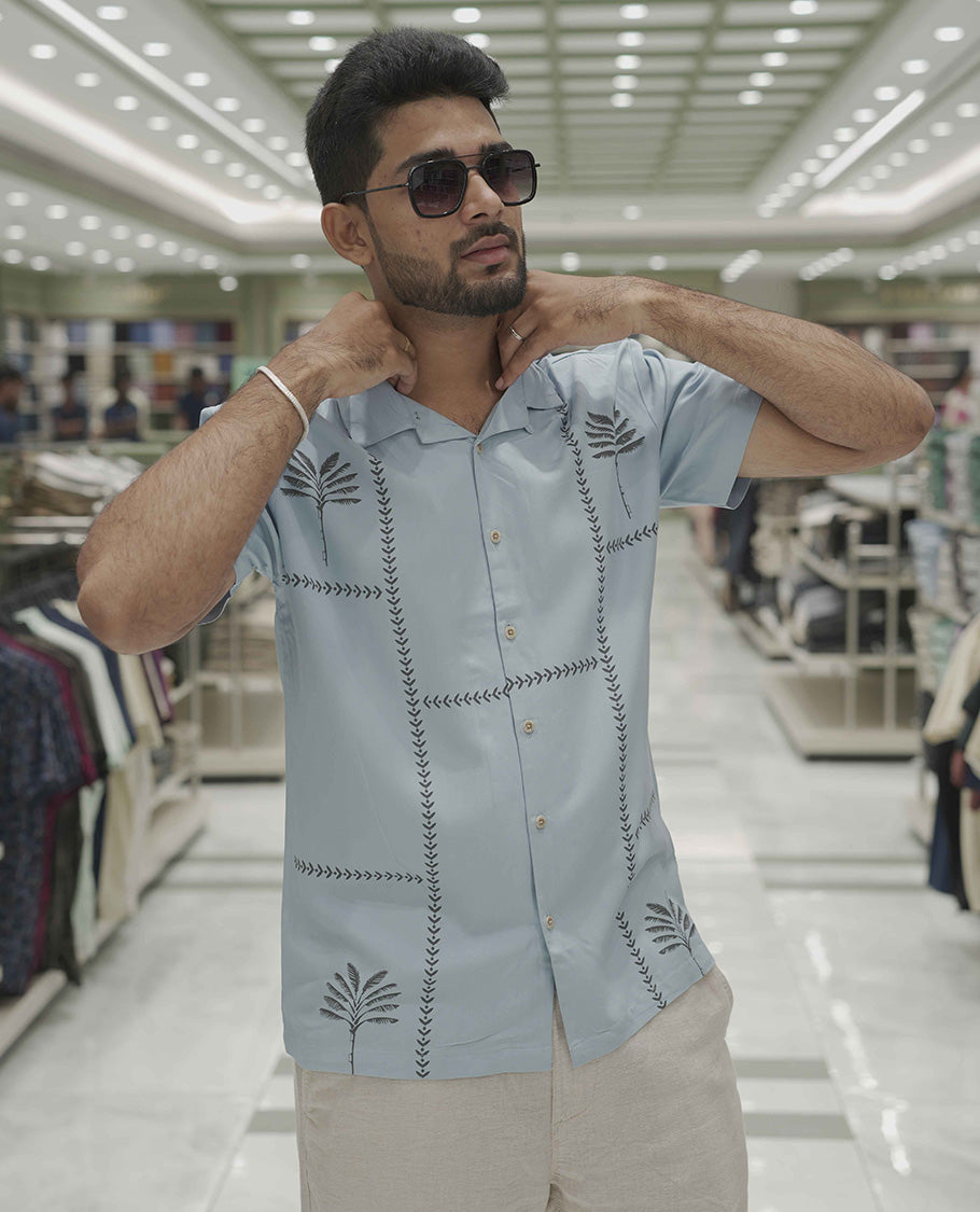 Light Blue Cotton-Blended Casual Shirt, Subtle Sparkled with Contemporary Prints, Comes with a Cuban Collar, Half-Sleeves, Regular Fit, and Regular Length