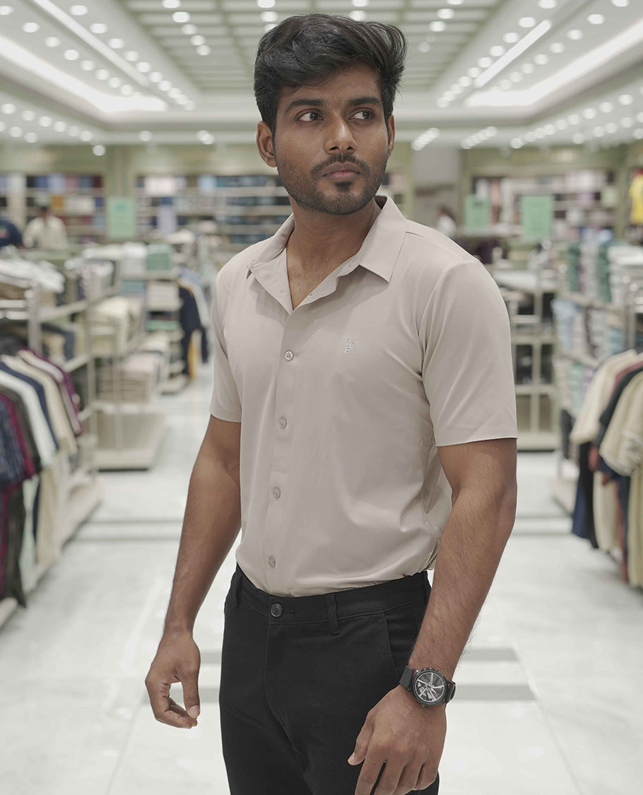 Khaki Plain Poly Lycra Blended Casual Shirt, Comes with a Spread Collar, Stitchless Half-Sleeves, Slim Fit, and Regular Length
