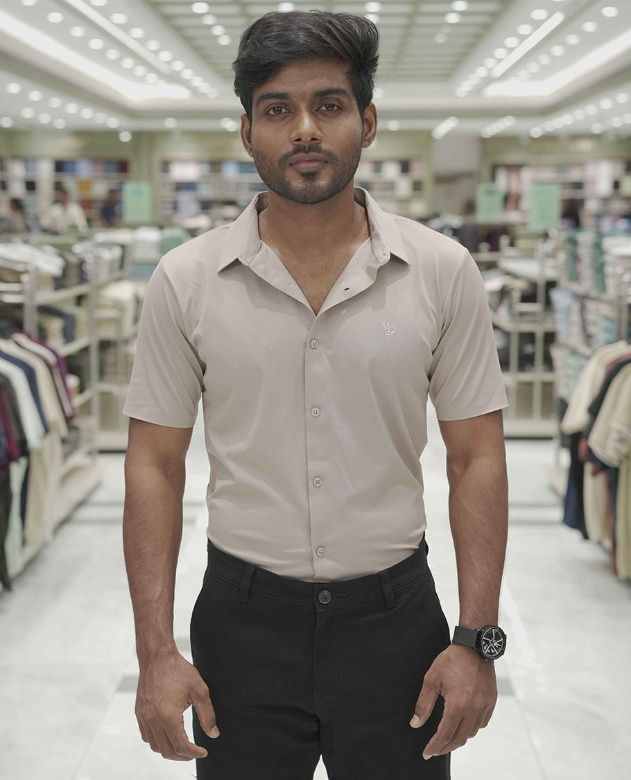 Khaki Plain Poly Lycra Blended Casual Shirt, Comes with a Spread Collar, Stitchless Half-Sleeves, Slim Fit, and Regular Length