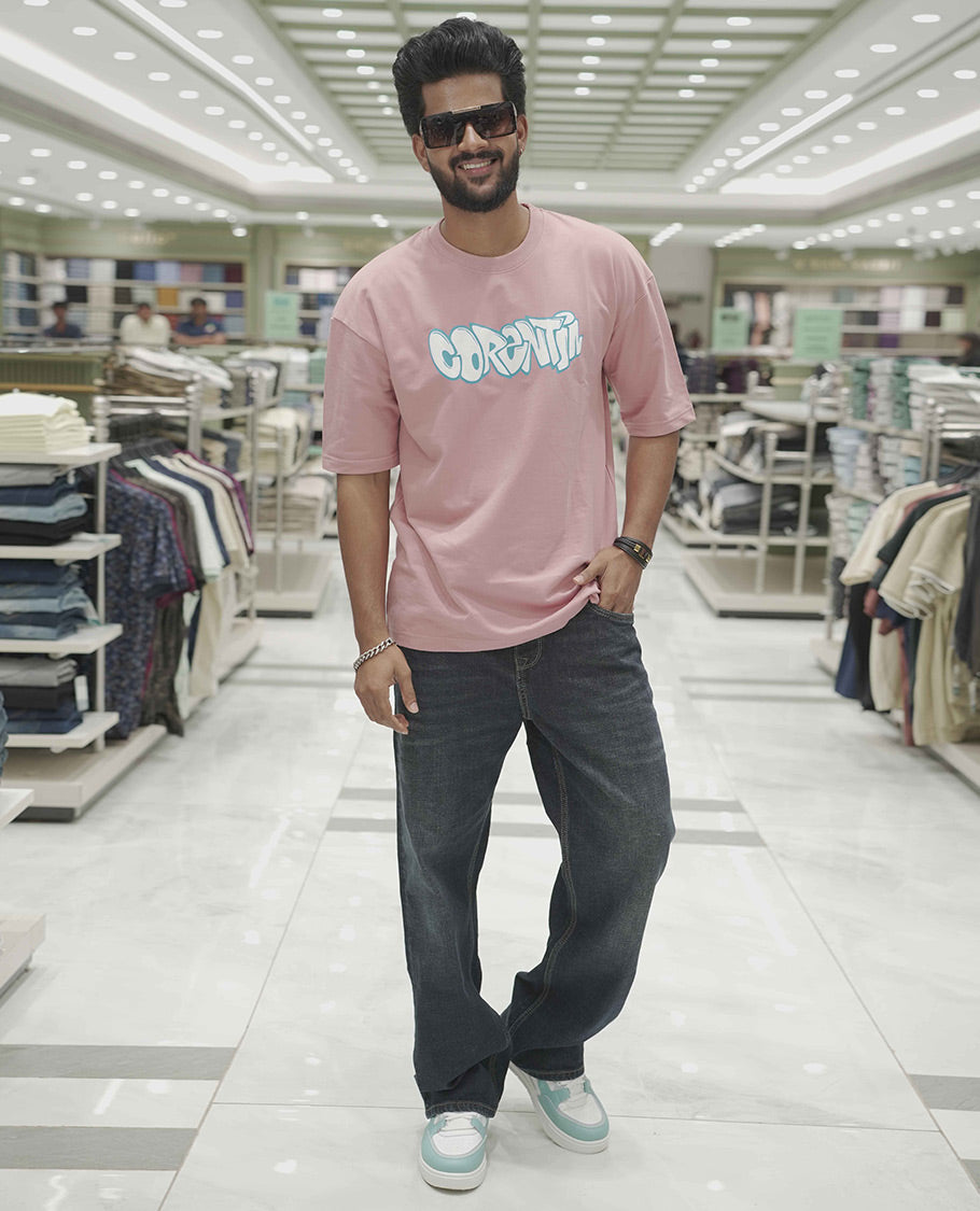 Pink Cotton-Blended Oversized T-Shirt, Elevated with Multi-Color Funky Motifs Front and Back Print, Comes with a Crew-Neck, Half-Sleeves, and Long Length