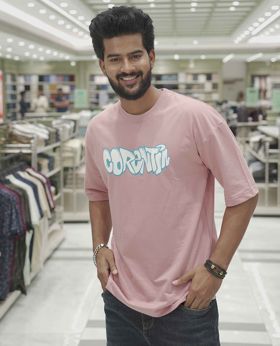 Pink Cotton-Blended Oversized T-Shirt, Elevated with Multi-Color Funky Motifs Front and Back Print, Comes with a Crew-Neck, Half-Sleeves, and Long Length