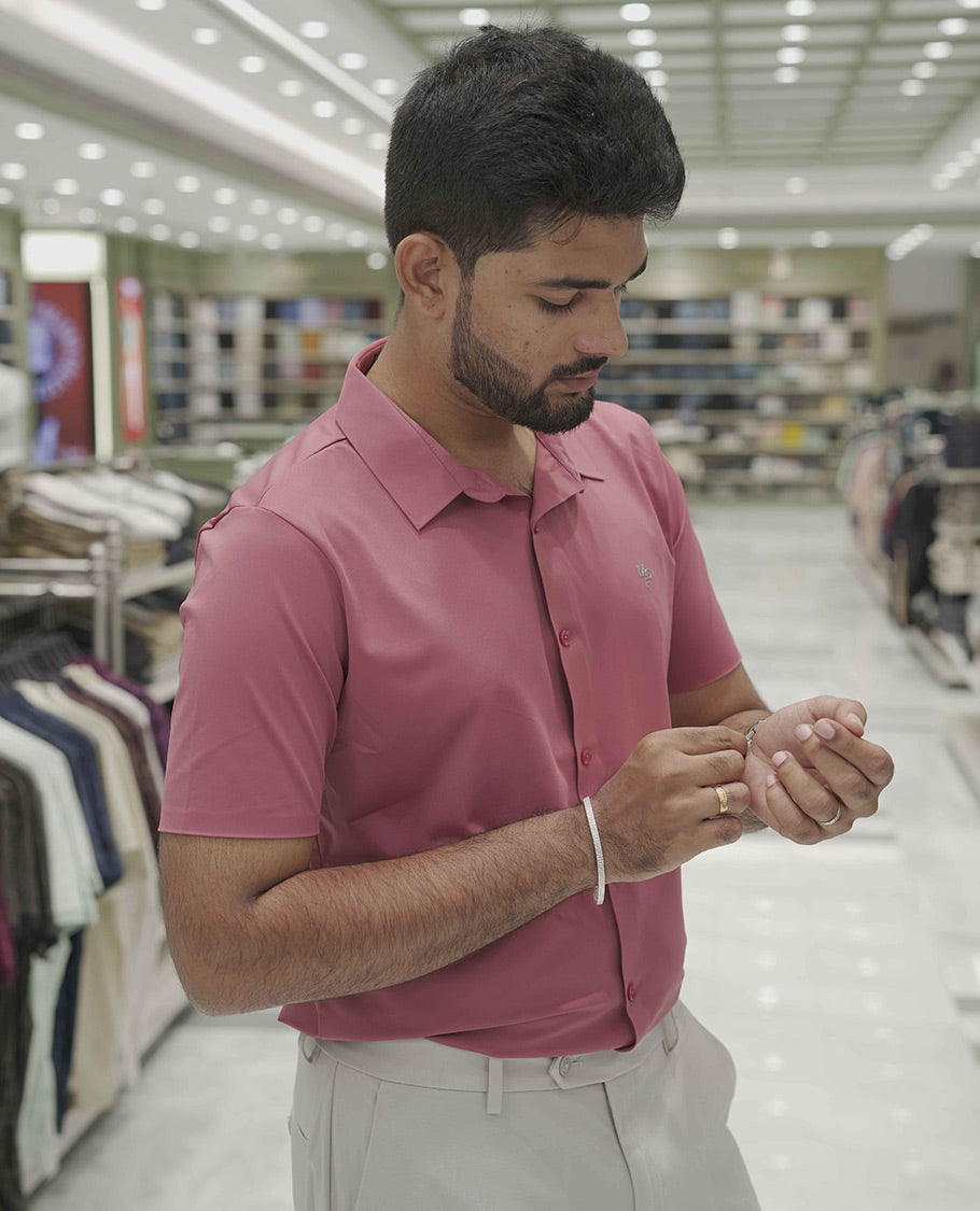 Pink Plain Poly Lycra Blended Casual Shirt, Comes with a Spread Collar, Stitchless Half-Sleeves, Slim Fit, and Regular Length