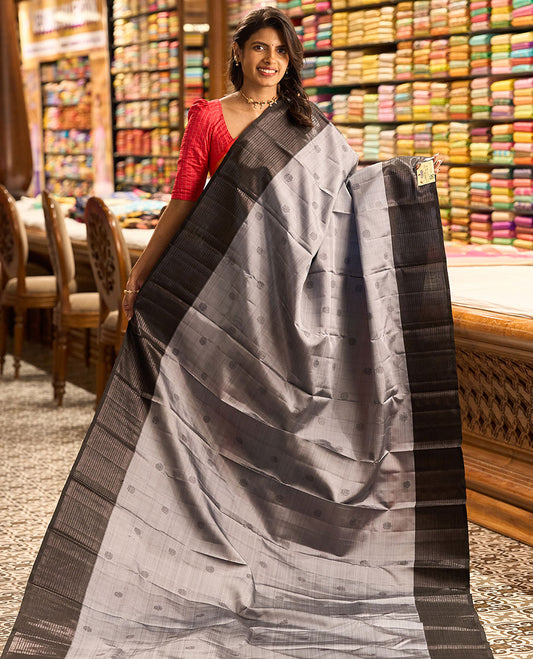 Grey buttas kancheepuram silk saree with self border of thilakam mokku, muthu, banaras design & zari design pallu