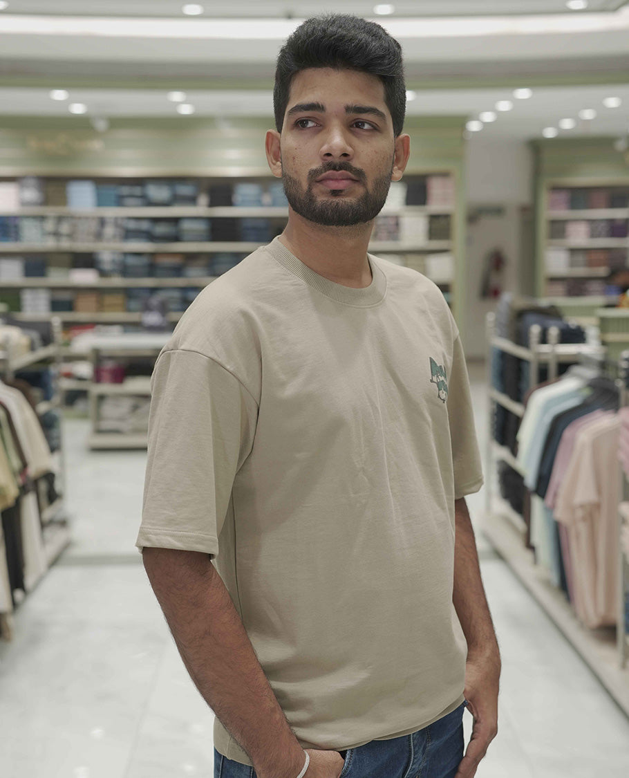 Cream Cotton-Blended Oversized T-Shirt, Elevated with Multi-Color Funky Motifs Front and Back Print, Comes with a Crew-Neck, Half-Sleeves, and Long Length