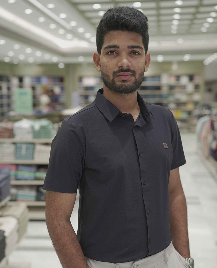 Navy Blue Plain Poly Lycra Blended Casual Shirt, Comes with a Spread Collar, Stitchless Half-Sleeves, Slim Fit, and Regular Length