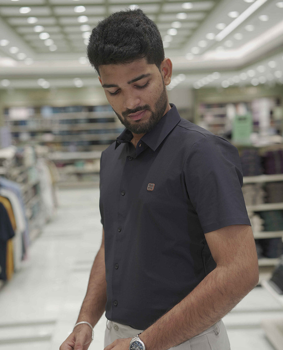 Navy Blue Plain Poly Lycra Blended Casual Shirt, Comes with a Spread Collar, Stitchless Half-Sleeves, Slim Fit, and Regular Length