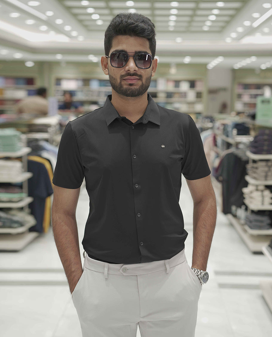 Black Plain Poly Lycra Blended Casual Shirt, Comes with a Spread Collar, Stitchless Half-Sleeves, Slim Fit, and Regular Length