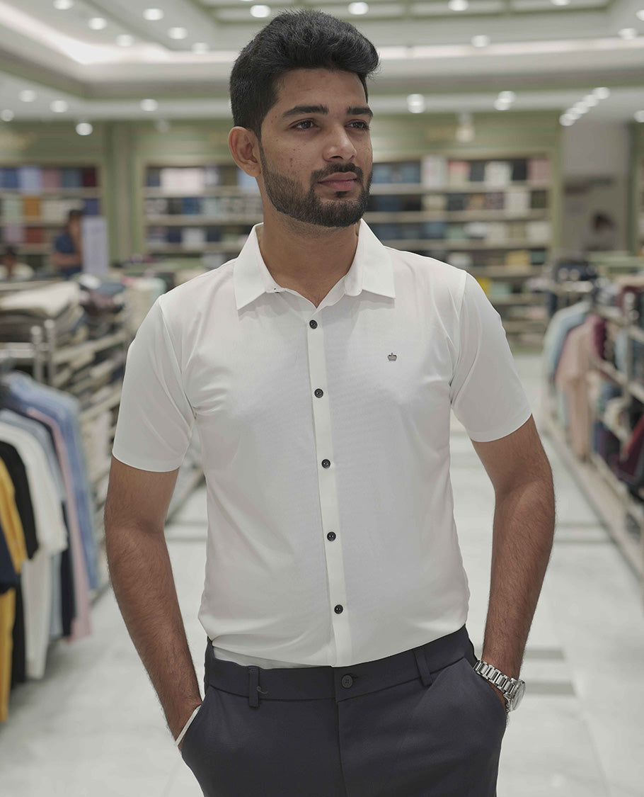 Cream Plain Poly Lycra Blended Casual Shirt, Comes with a Spread Collar, Stitchless Half-Sleeves, Slim Fit, and Regular Length