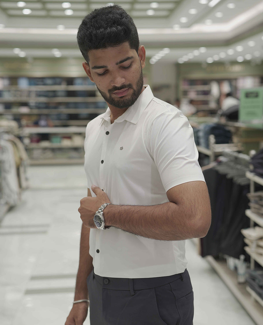 Cream Plain Poly Lycra Blended Casual Shirt, Comes with a Spread Collar, Stitchless Half-Sleeves, Slim Fit, and Regular Length