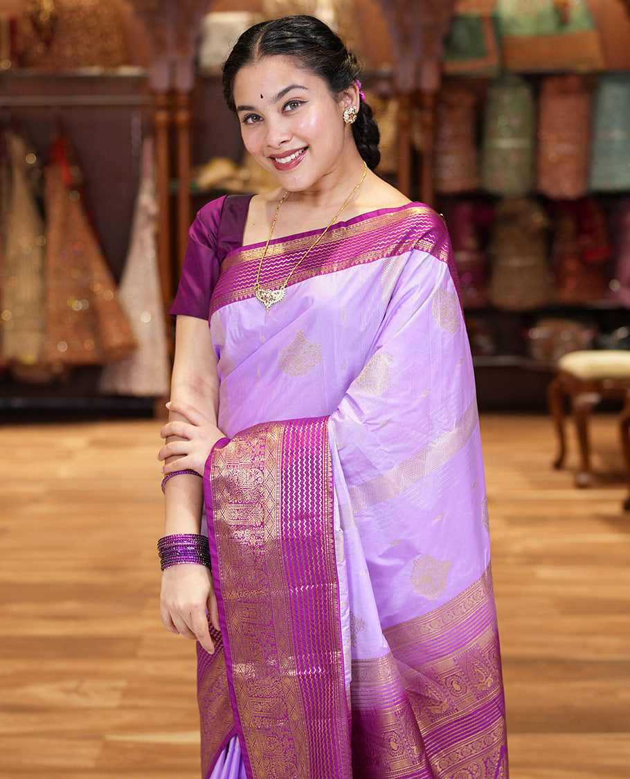 Lavender Kanchipuram Budget Silk Saree, Accentuated with Zari Buttas and Zari Stripes All Over Its Body, Complemented by a Contrast Traditional Zari Design Border, Zari-Rich Jaal Pallu, and Paired with a Contrast Blouse