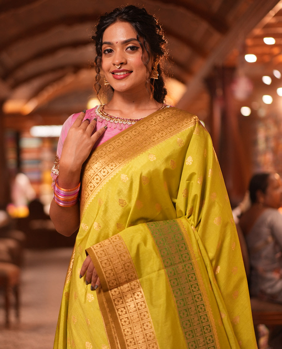 Parrot Green Fancy Raw Silk Saree, Subtly Woven with Buttas, Peacock-Flower Traditional Border, and a Matching Blouse