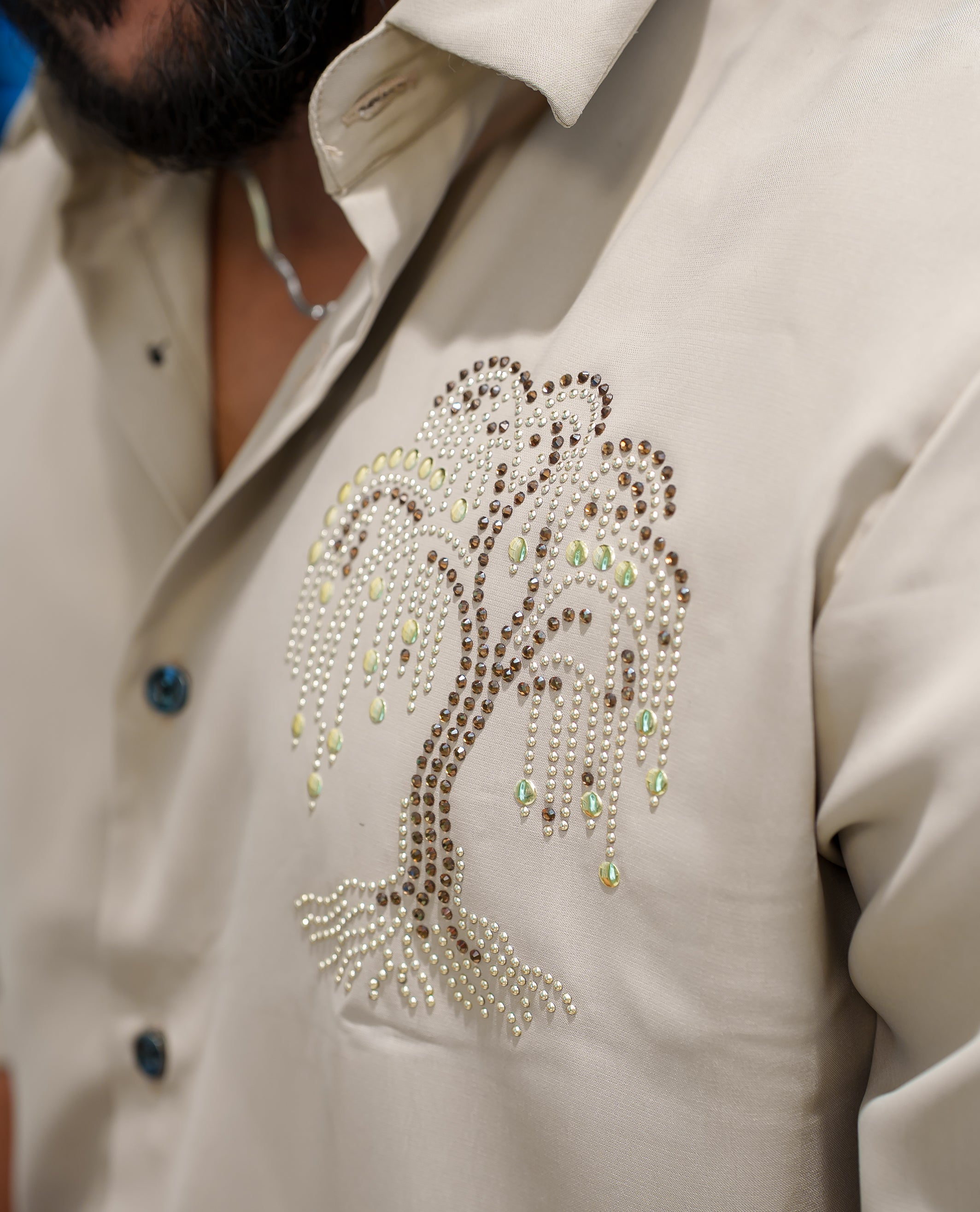 Cream Poly Blended Party Wear Shirt, Decorated with Tree-Motif Embroidery, Featuring a Spread Collar, Full Sleeves, Slim Fit, and Regular Length
