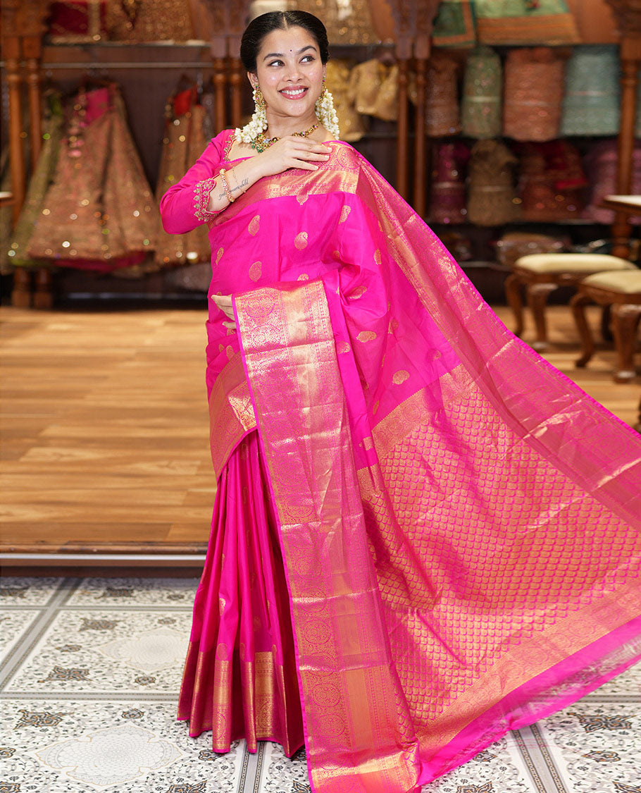 Pink Budget Silk Saree Bedecked with Paisley Buttas All Over Its Body, Highlighted by a Traditional Zari Design Border, Grand Pallu of Jaal Designs, and Paired with a Matching Blouse