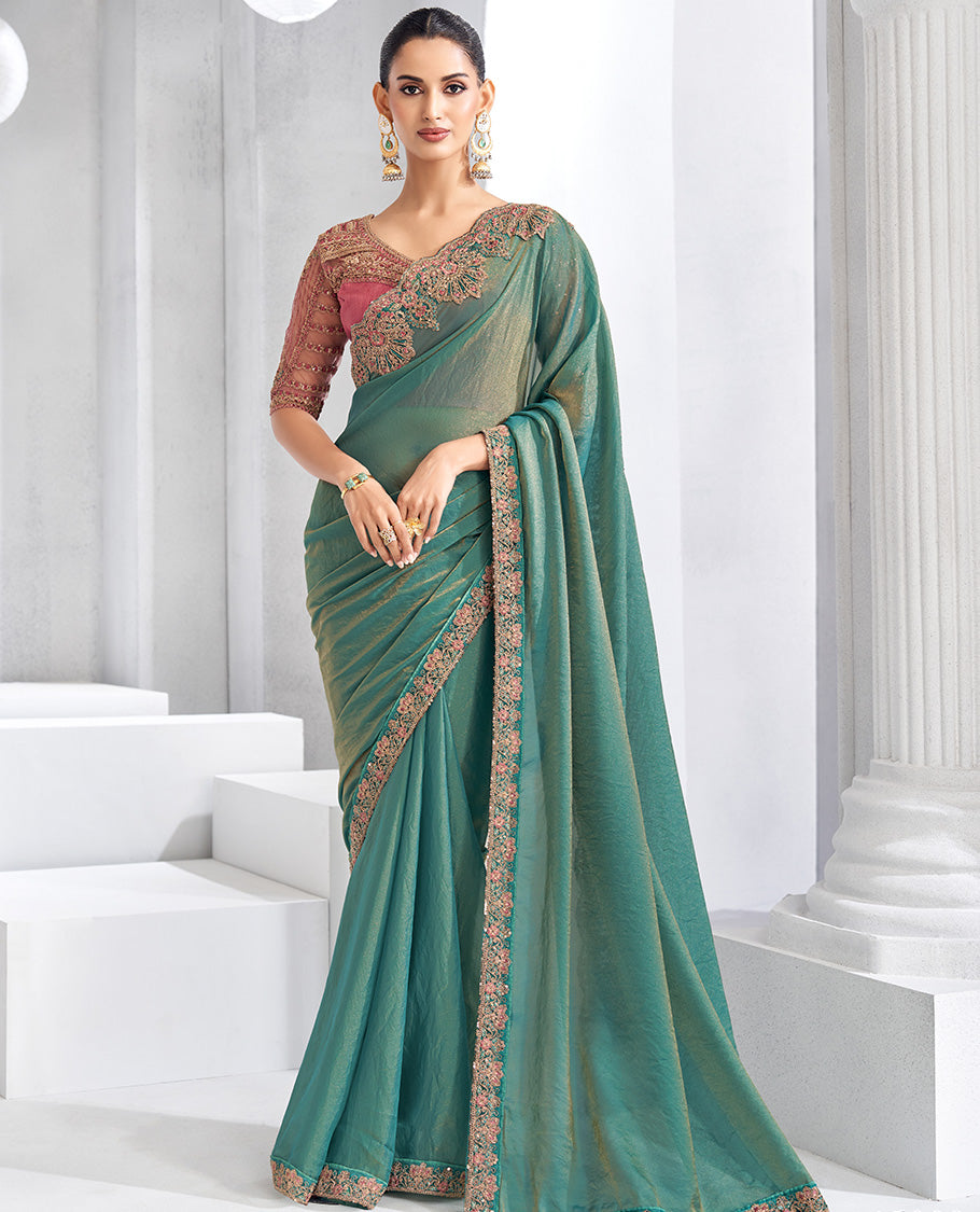 Green plain designer saree, contrast floral embroidered scallop border, and self-pallu