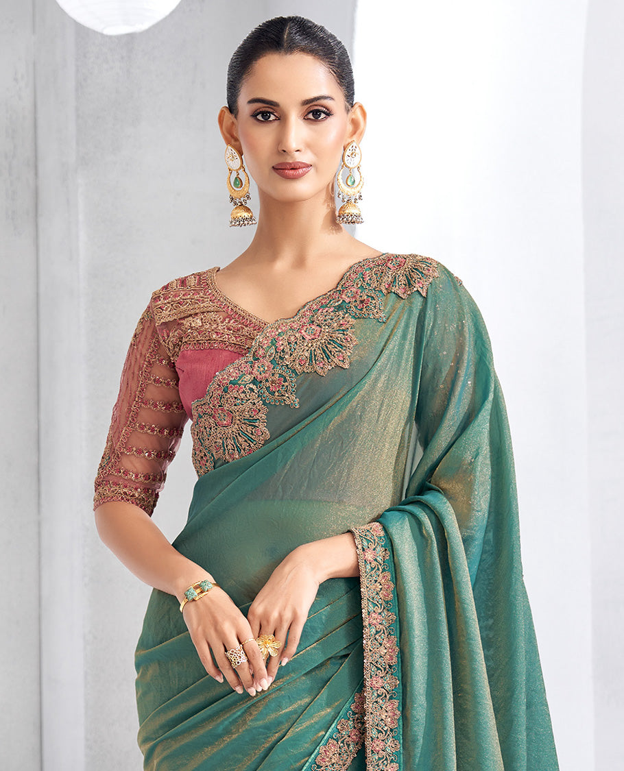 Green plain designer saree, contrast floral embroidered scallop border, and self-pallu
