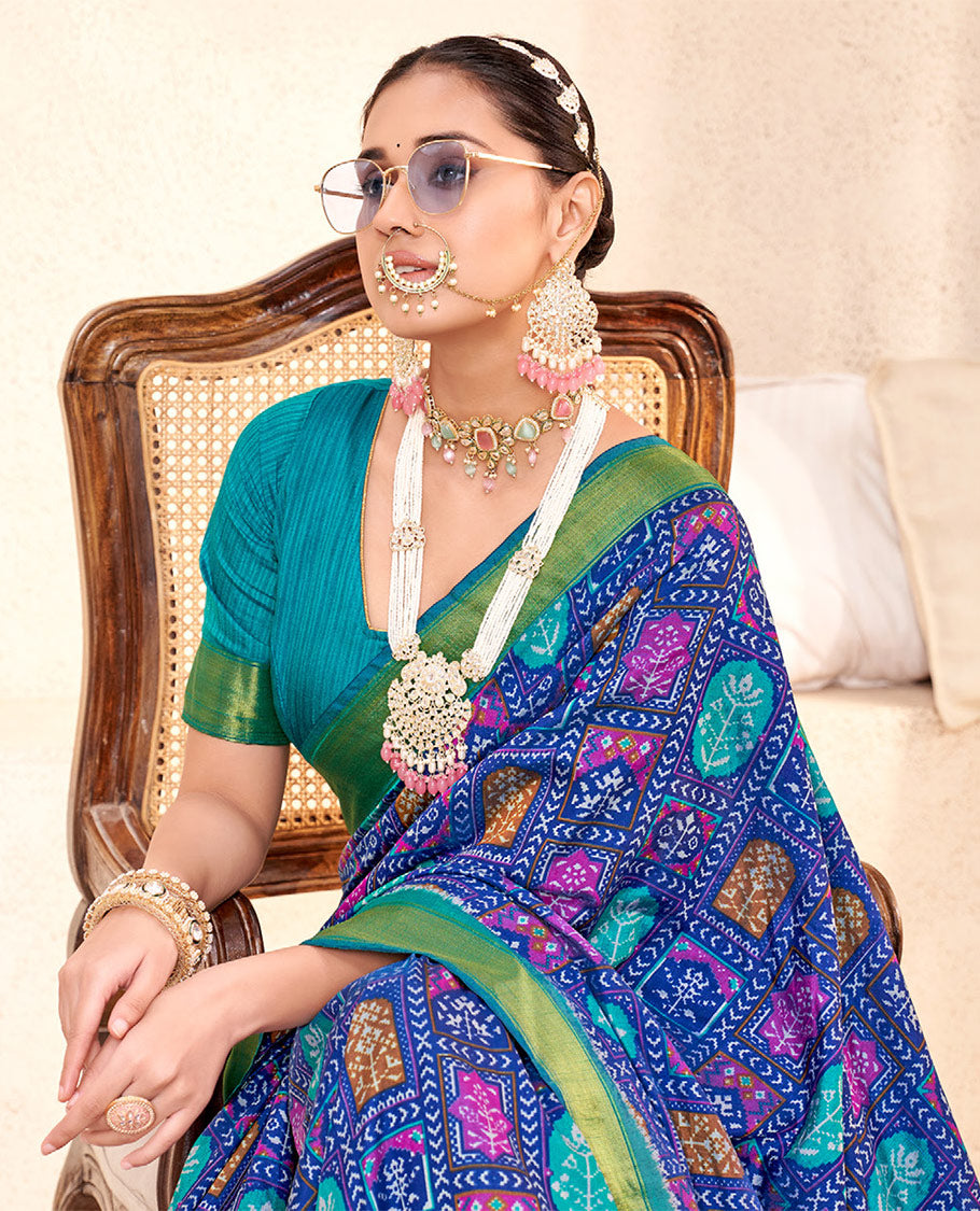 Blue Patola Fancy Raw Silk Designer Saree, Accentuated with Intricate Design, a Bavanji Border, Intricately Designed Pallu, and a Contrast Blouse