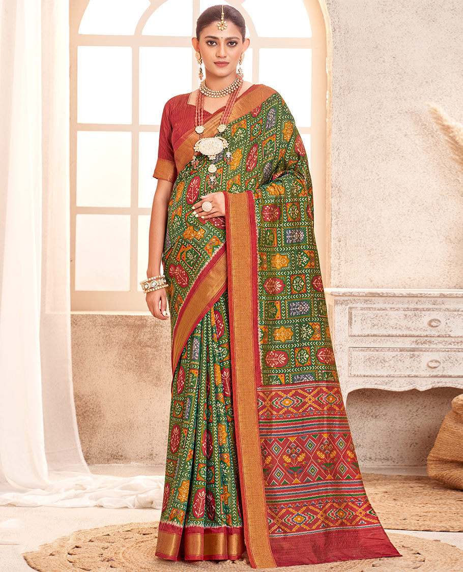 Green Patola Fancy Raw Silk Designer Saree, Bedecked with Intricate Design, a Bavanji Border, Intricately Designed Pallu, and a Contrast Blouse