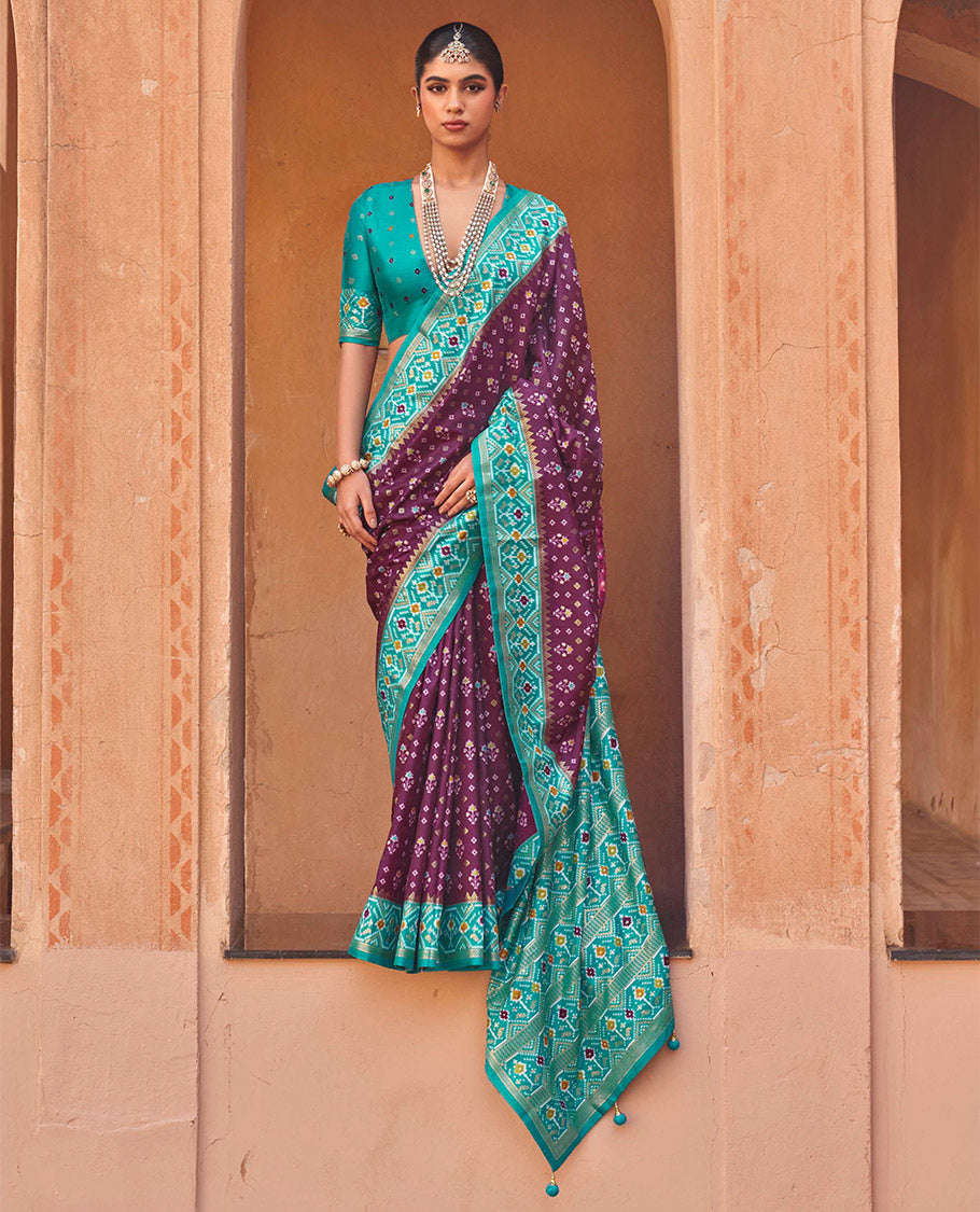 Purple Ikat Patola Designer Saree, Embellished with Floral Ikat Buttas, Complemented by a Contrast Ikat Border, Intricate Pallu, and a Contrast Blouse