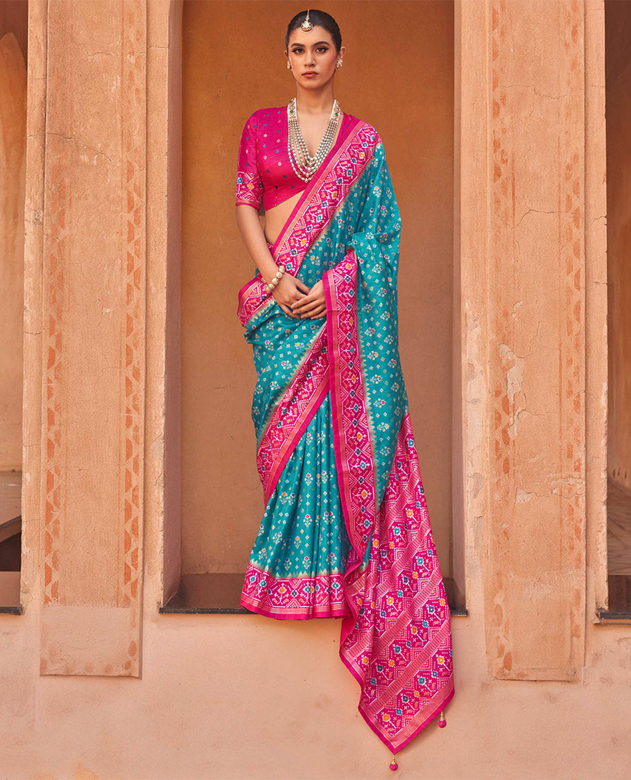 Light Blue Ikat Patola Designer Saree, Decked Up with Floral Ikat Buttas, Complemented by a Contrast Ikat Border, Intricate Pallu, and a Contrast Blouse
