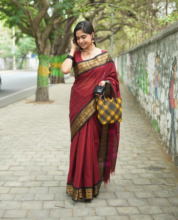 Maroon Plain Chettinad Cotton Saree, Complemented by a Contrast Rudraksham Design Traditional Zari Border, Subtly Striped Pallu, and Paired with a Matching Blouse